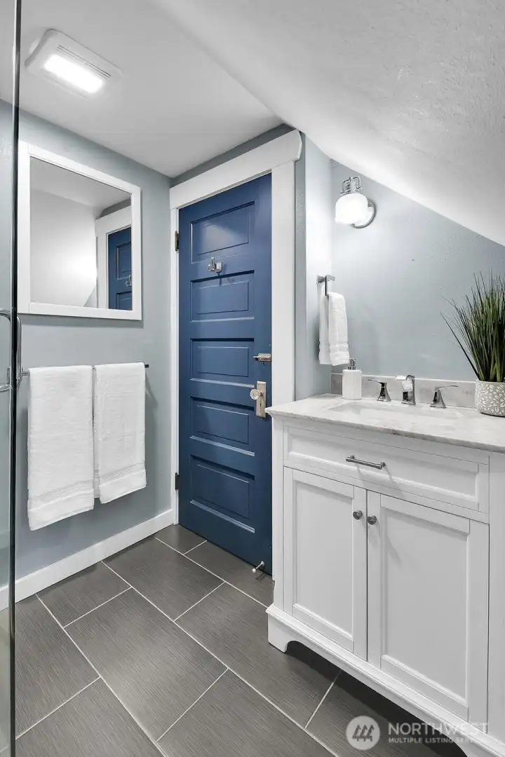 Stylishly updated ¾ bath conveniently located on the upper level.