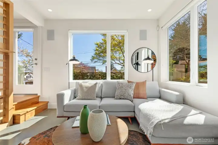 Spacious and bright living room with door to backyard