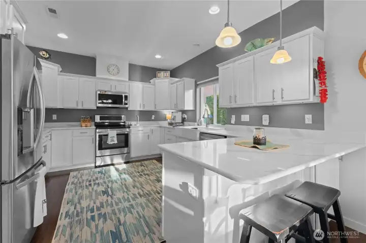 Updated kitchen with granite counters, stainless steel appliances & recessed lights