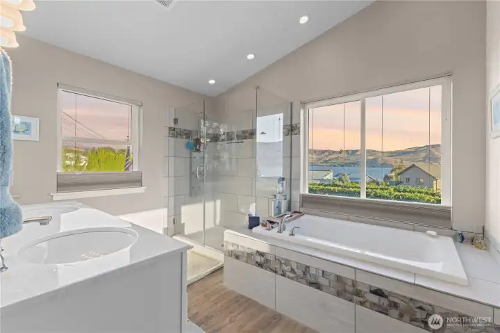 Primary bath with soaking tub and lake views