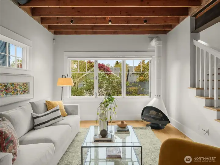 Folding windows open from wall to wall connecting indoor and outdoors.
