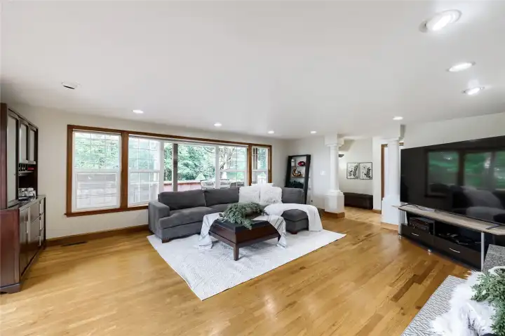Light and bright spacious living room with a wall of windows!