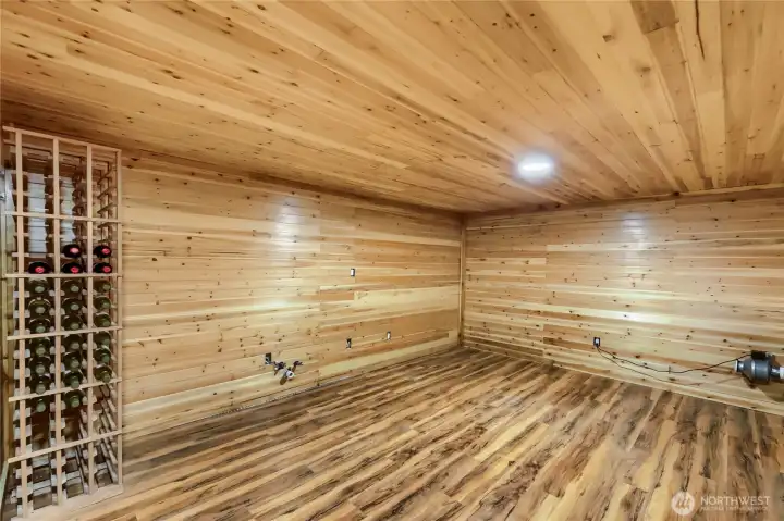 Cedar-lined bonus room offering flexible use as a wine cellar, hobby space, or private retreat, originally designed with enhanced security and featuring a convenient sink