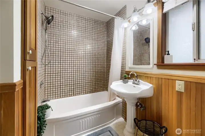 Main level primary bedroom's private bath
