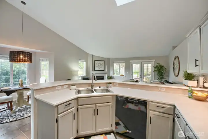 Open concept kitchen, living & dining boost natural light, facilitate easy entertaining and fosters connection by eliminating walls.