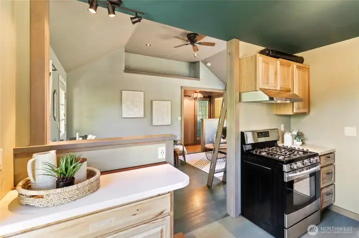 Kitchen with new wood cabinets and custom pantry.