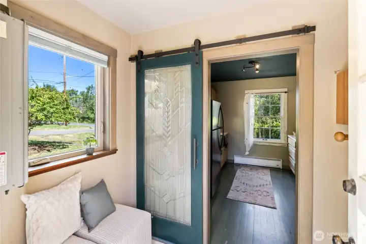 Mud room with propane instant hot water heater.