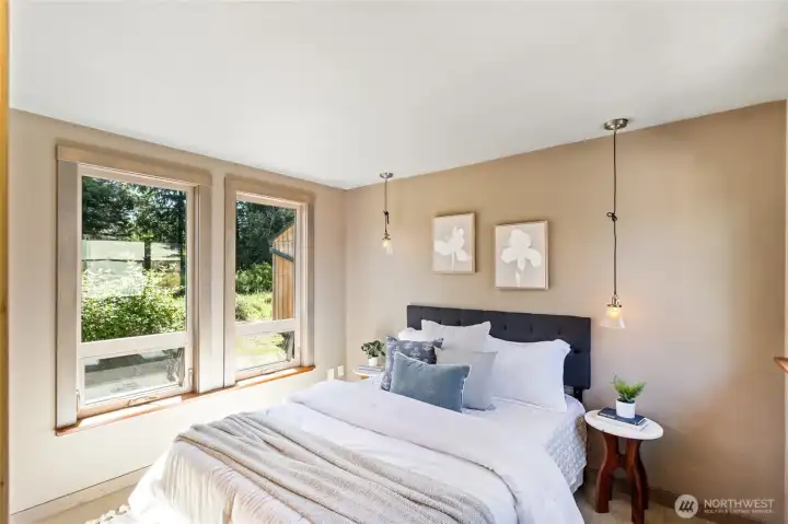 Bedroom to the south with dbl pane windows on both sides.