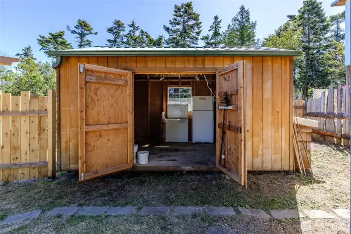 Storage shed with power, fridge and chest freeze convey.