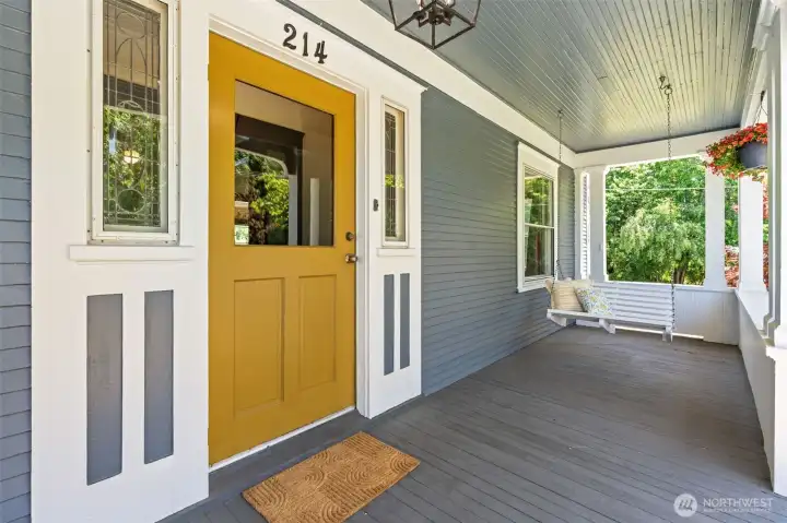 The welcoming front porch, complete with original leased glass sidelights, a porch swing, and room to sit and savor your morning coffee, offers a place to slow down and enjoy the simple pleasures that have drawn generations to this special home.