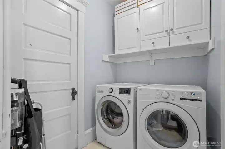 Just off the mudroom, the main-floor laundry room features an attached half bath, creating a practical and convenient space perfectly suited for country living.