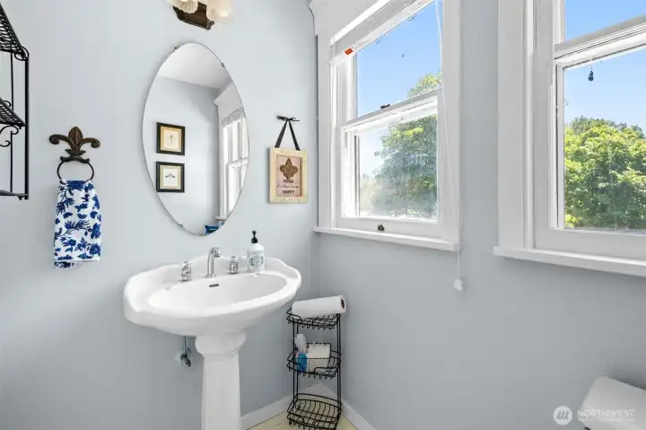 The main-floor half bath adds convenience for everyday living and entertaining, just steps from the home's gathering spaces.