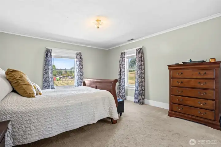 A rare feature in a historic home, the primary suite includes an attached bath, ample closet space, and a charming dressing room that creates a private retreat.