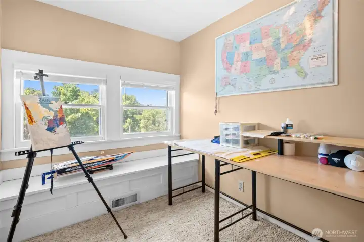 The third floor features matching rooms filled with possibility, creating ideal spaces for offices, studios, hobbies, or play.