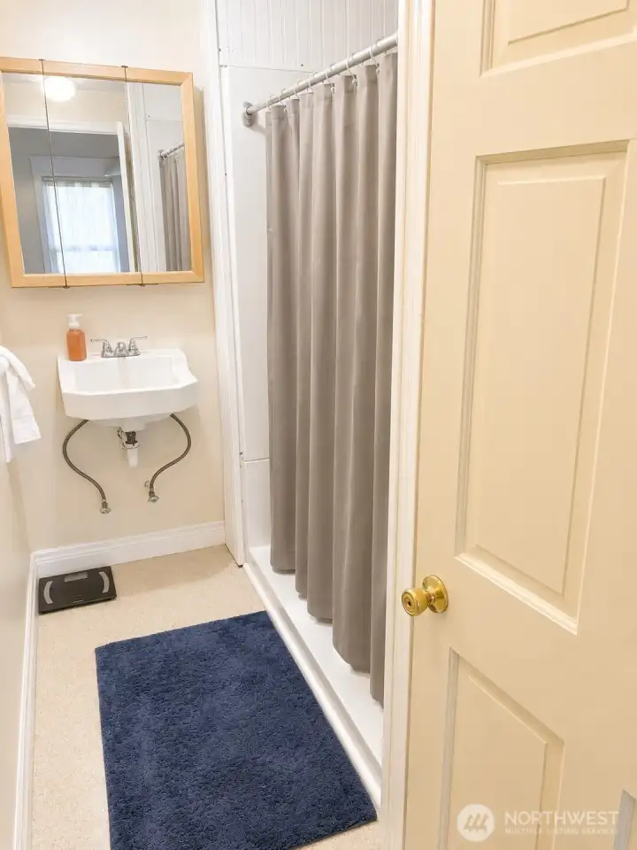 The carriage house bathroom adds convenience and functionality, making the space well-suited for guests, rental use.