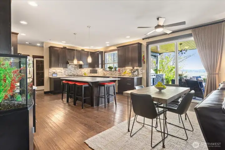 Plenty of space- Entertainers dream. High end kitchen, enormous island to gather around, informal dining ( Formal dining room as well thru butlers pantry) and the oh so cozy living room!