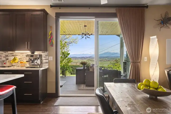 Kitchen, informal dining and living room. Open up the slider doors to expand your living space.