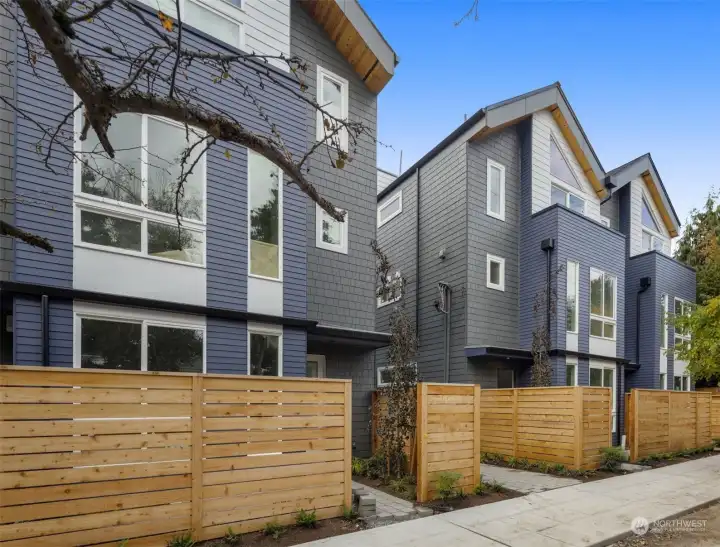 A fenced entry welcomes you home, offering privacy and curb appeal in one of Seattle's most vibrant neighborhoods.