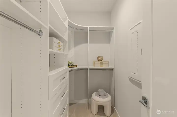 Photos of model home with similar finishes & floor plan. Designed with organization in mind, this spacious walk-in closet offers custom shelving, ample storage, and a dedicated space to keep everything neatly tucked away.