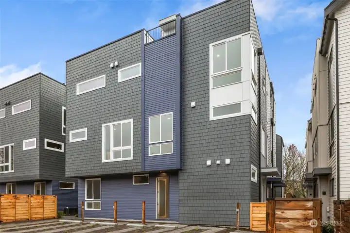 A striking exterior with clean lines and modern textures sets the tone for sophisticated urban living.