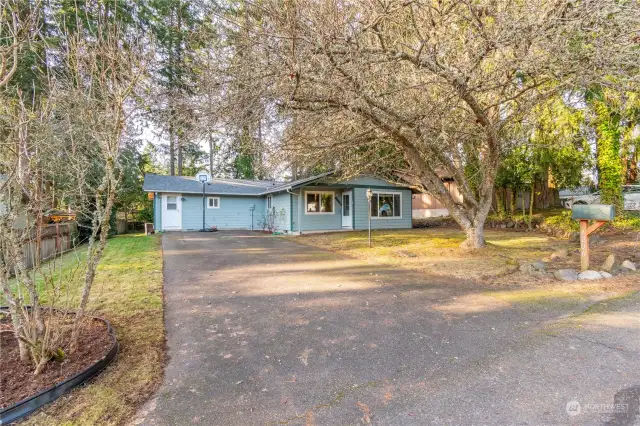 Lot SQ FT is 9,100 SQ FT Yard is partially fenced. Tree is front yard is beautiful in the spring with pink blossoms.