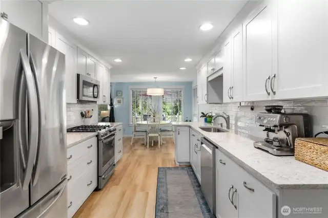 Bright, galley kitchen with dining space
