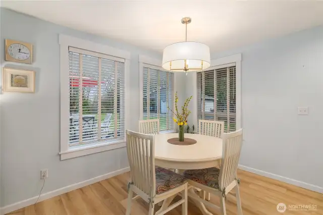 Dining off of kitchen with views of the backyard