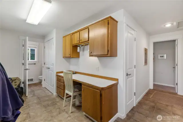 Over-sized laundry room with desk, sewing area PLUS additional 1/2 bath!