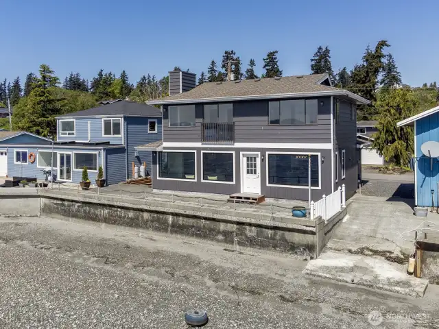 Waterfront living doesn't get any better than this! Listen to the waves relaxing you to sleep at night. South facing for all day sun. Concrete patio and bulkhead perfect for every day and entertaining.