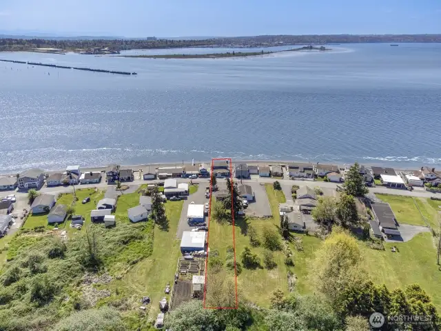 Looking south at Jetty Island and the City of Everett. The big building is Providence Hospital. Note the extra deep lot with a detached 2 car garage with shop area and bonus room.