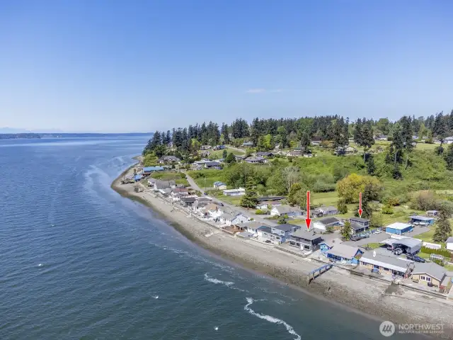 Hat Island is in the distance to the left and Whidbey Island is beyond that. Great beach walking. Note that the water is deep enough for mooring buoys. You can see the bonus / multi-purpose room over the garage.