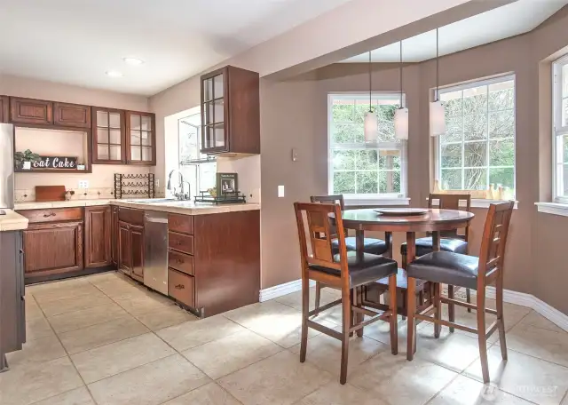 Open, light filled kitchen with breakfast nook.