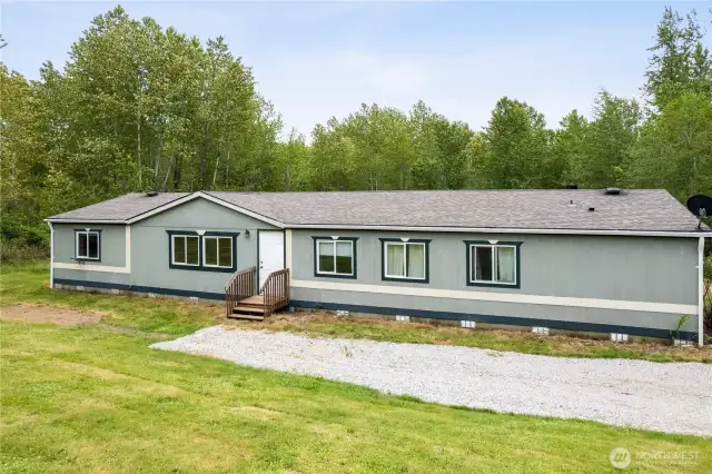Peaceful and private retreat featuring over 1,800 square feet of living space and six acres of expansive land to explore.