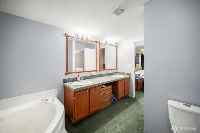 Generously sized bath with a deep soaking tub for ultimate relaxation.