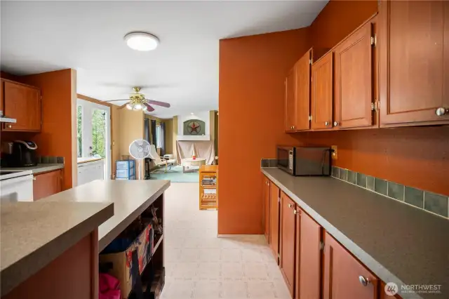 Roomy kitchen offering ample counter space for meal prep.