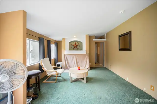 Separate family room from the main living room. Designated area ready for a cozy fireplace.