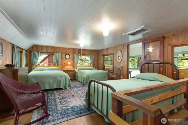 Large Open Sleeping Area with Lake and Forest Views