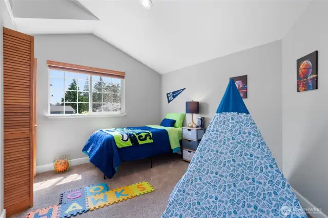 Directly across from the hall bathroom, you enter into the first bedroom. Let's go Hawks!