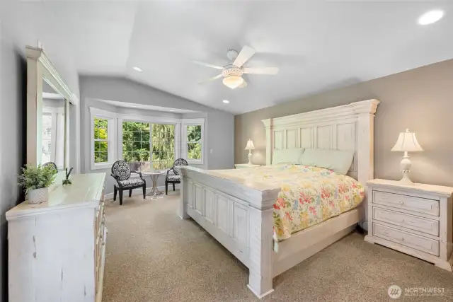 Now we check into the oversized Primary Suite. And how Sweet it is! This room features...everything! Vaulted ceiling, ceiling fan, bayed windows, Walk-in closet, and 5 piece ensuite.