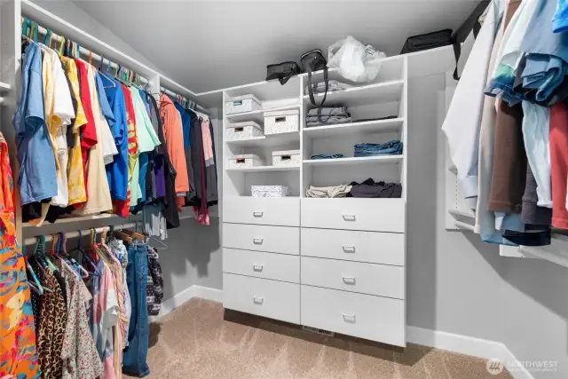 This well organized space can handle all your wears. The closet closes off with a pocket door. *Notice the extra shelf space above the hanging rods...Nice!