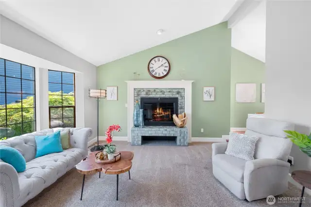 Just steps into the entryway you find the bright and airy Living Room. Vaulted ceiling and cozy wood burning fireplace set the tone.