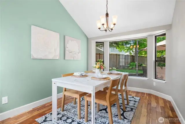 *Wolf Whistle* Check out that sexy Dining Room. Dining Room overlooks the gorgeous backyard keeping you connected with the outdoors as you entertain. Vaulted ceiling, acacia wood flooring, and light surroundings make this room a favorite.