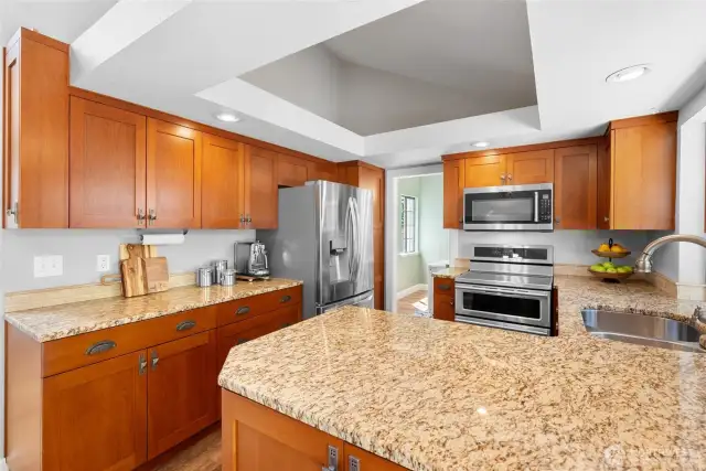Ohh la la! This kitchen features gorgeous granite countertops and beautiful custom cabinets. Be sure to open all the cabinets to appreciate all the custom features. All newer stainless steel appliances stay. The induction range also had double ovens. Dessert will be ready right after dinner!