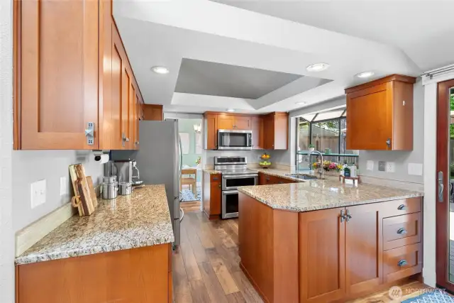 Notice the great use of space with the additional cabinets on the outside of the kitchen. So handy! Also please notice the lovely garden window. Excellent for growing herbs, succulents, or just keeping an eye on the backyard happenings.