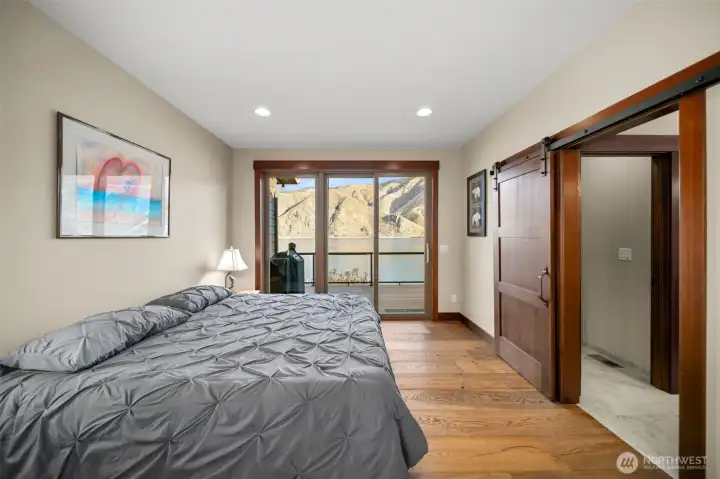 Main floor primary suite - slider to deck.