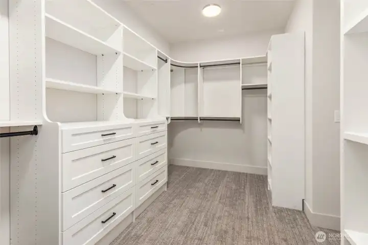 Generous Primary closet with custom designed/built solid shelving. Solid shelving throughout the residence