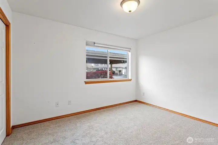 Second bedroom with brand new carpet.