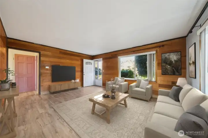 View of the living room from the kitchen. (virtually staged)