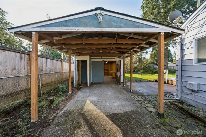 Covered carport and detached garage.