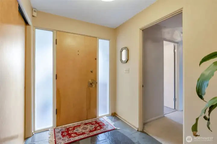 Front door entrance, 3 bedrooms down hallway on right.